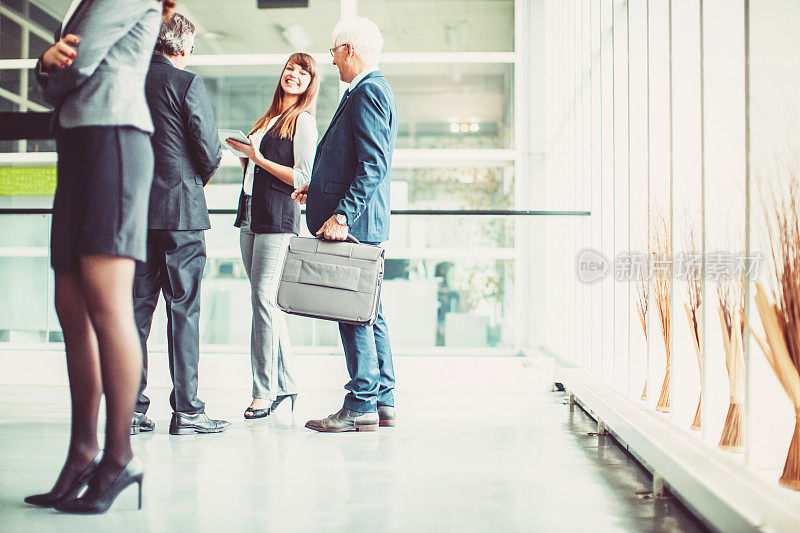 Group of business people in the office building lobby